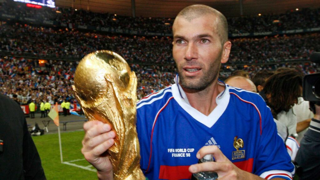 france's zinedine zidane holds the world cup trophy after an exhibition soccer match in saint denis